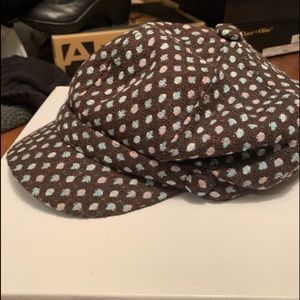 Brown hat with pink/ blue dots .